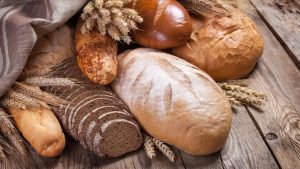 Bread and ears on an old table.