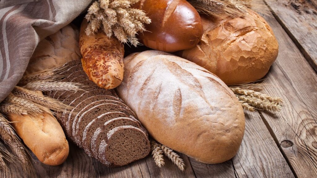 Bread and ears on an old table.