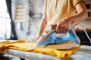 young-woman-ironing-close-up-2023-11-27-05-05-21-utc